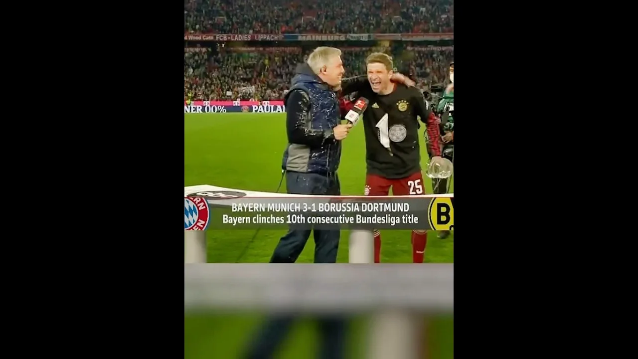 Bastian Schweinsteiger receives a beer shower from Thomas Müller during Bundesliga 2022 celebration